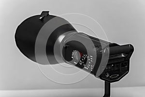 Studio Strobe Light with Reflector on Gray Background