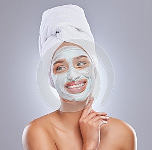 Studio, woman and face mask for skincare, cosmetic and facial treatment on white background. Beauty, towel or smile for