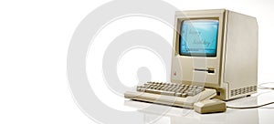 Studioshot of an original Macintosh 128k called Apple Macintosh on white background. This was the first produced Mac, released on