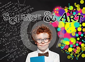 Studious child scholar in glasses on blackboard background with science formula and art pattern