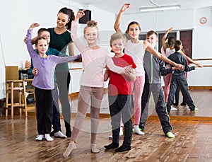 studious little boys and girls dancing pair dance