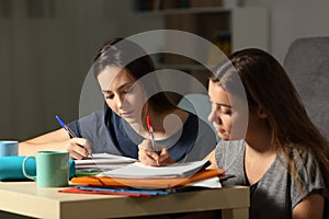Studious students studying hard in the night photo
