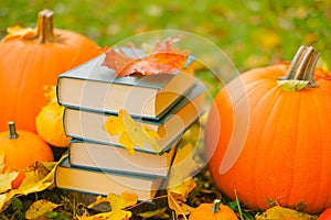 Study and education.back to school. Autumn books.Halloween books. Autumn reading.Stack of books,pumpkins on the autumn