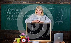 Study and education. Modern school. Knowledge day. teacher with alarm clock at blackboard. Time. Back to school