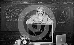 Study and education. Modern school. Knowledge day. teacher with alarm clock at blackboard. Time. Back to school