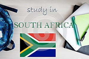 Study in South Africa. Background with notepad, laptop and backpack. Education concept