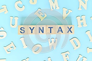 Study syntax in linguistics concept. Wooden blocks word typography flat lay in blue background.