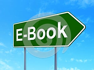 Studying concept: E-Book on road sign background