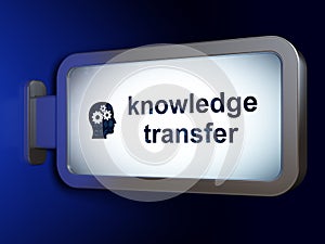 Studying concept: Knowledge Transfer and Head With Gears on billboard background