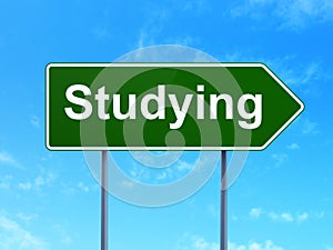Studying concept: Studying on road sign background