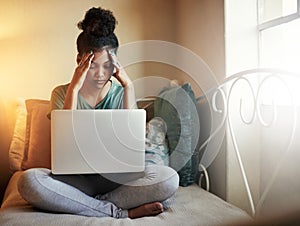 Studying is too much. Full length shot of a young female student studying at home.