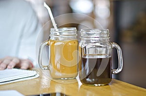 Studying with two mason jar coffees