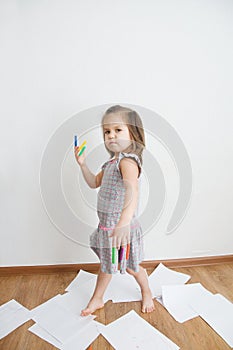 Stuff warrior. child playing with felt tip pens. baby girl painting and playing with stuff. colorful felt pen caps on fingers