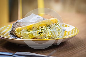 Stuffed arepa made from cornmeal, traditional cuisine of Colombia and Venezuela