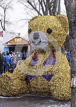 Stuffed bear in the park at Carnaval. People shoot at a dash