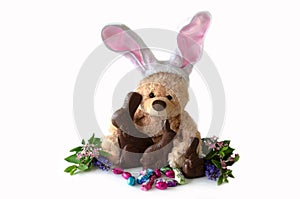 Stuffed bunny and chocolate bunnies photo