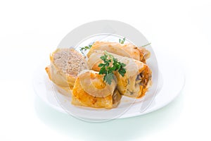 Stuffed cabbage leaves with minced meat and rice in tomato sauce.