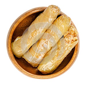 Stuffed cabbage leaves, vegan cabbage rolls, in a wooden bowl