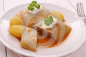 Stuffed cabbage rolls with potato, sour cream