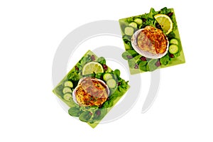 Stuffed clams with crabmeat and bread crumbs with salad and lemon isolated on white background. Seafood concept
