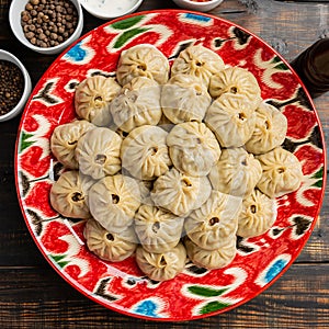 Stuffed dumplings, manti of dough and minced on wooden background