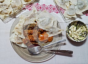 Stuffed dumplings and sautÃÂ©ed cabbage. photo