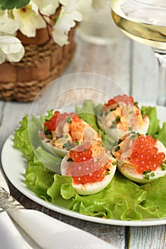 Stuffed eggs with salmon caviar