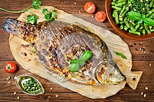 Stuffed fish cooked on bbq photo