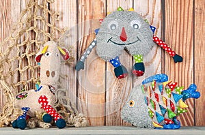 Stuffed funny toys on wooden background