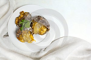Stuffed Parasol Mushroom on white plate with copy space