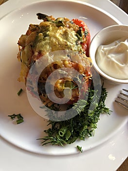 Stuffed pepper with sour cream and herbs