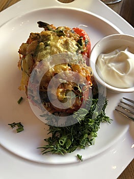 Stuffed pepper with sour cream and herbs