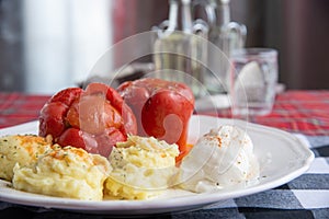 Stuffed peppers plate served with mashed potatoes and cream cheese called Kajmak photo