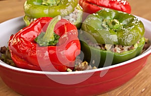 Stuffed peppers in a red dish