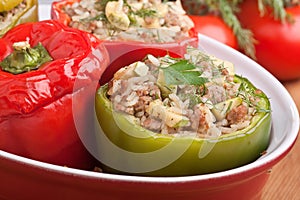 Stuffed peppers in a red dish