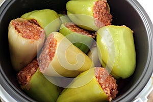 Stuffed peppers with rice and meat in a multicooker.
