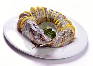 Stuffed pike on a white plate