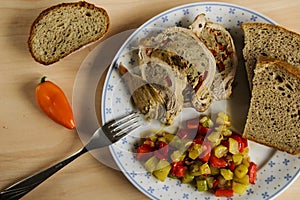 Stuffed pork with vegetables and bread