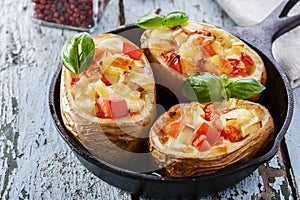 Stuffed potatoes with cheese and tomatoes
