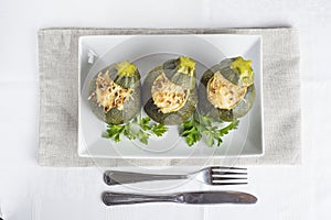 Stuffed round courgettes with grated cheese