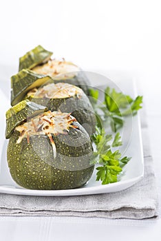 Stuffed round courgettes with grated cheese