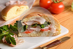 Stuffed sandwich with turkey and tomato breast