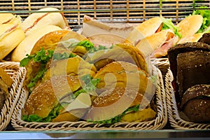 stuffed sandwiches with breaded cutlet and cheese and lettuce for sale in the bar counter