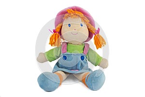 Stuffed soft sitting funny pig-tailed red-headed doll photo