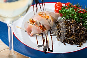 Stuffed squid with wild rice and cherry tomato is tasty dish