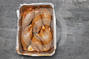 stuffed squids in plastic box take away