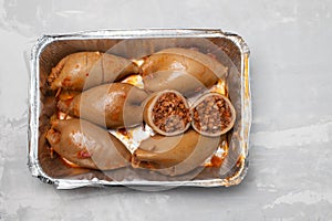 stuffed squids in plastic box take away