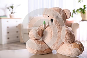 Stuffed teddy bear on table in child hospital