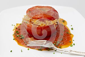 Stuffed tomato garnish and fork