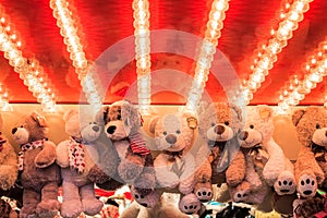 Stuffed toy bears on display awarded as winning prizes at Christmas funfair winter wonderland